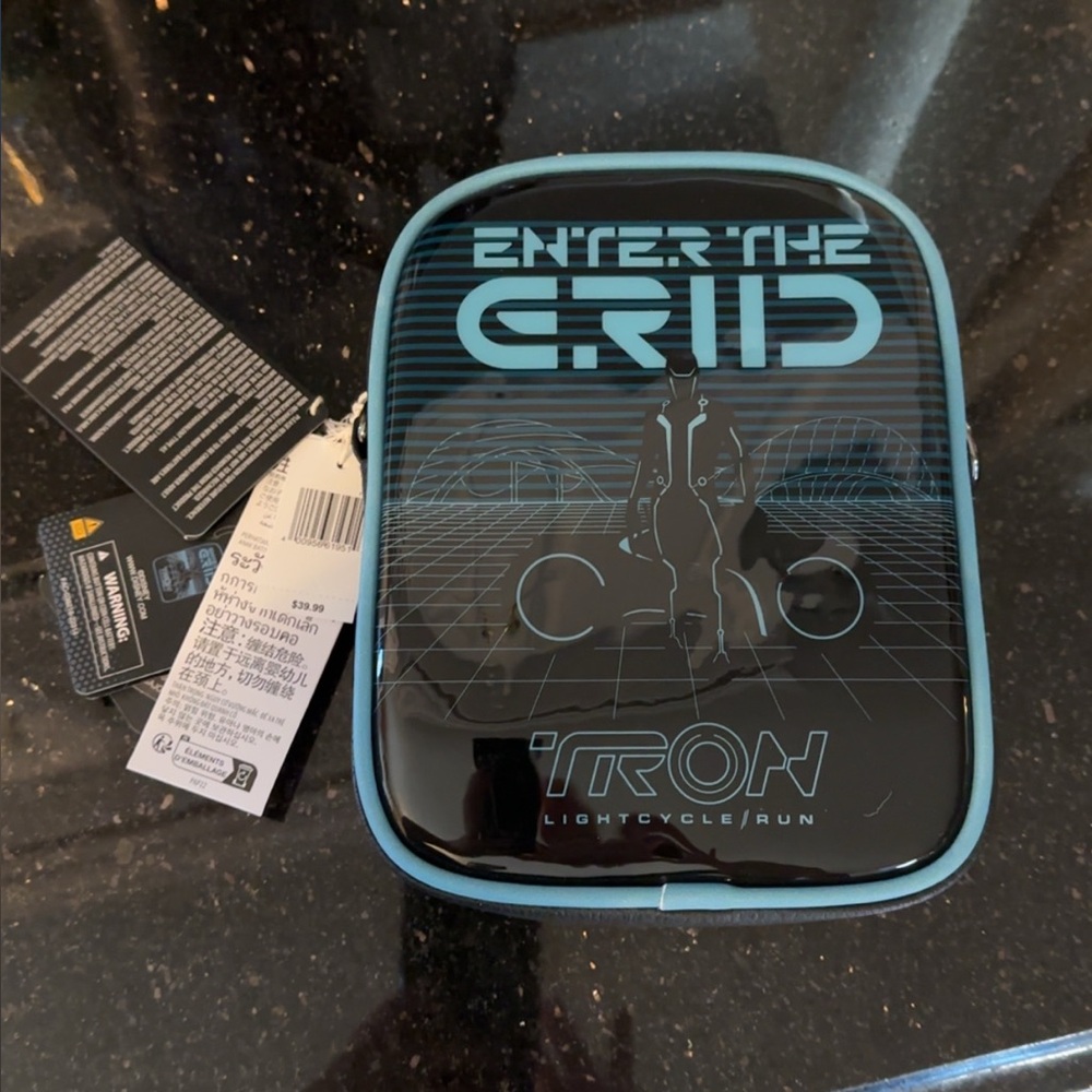 NEW Loungefly Disney Parks TRON Lightcycle Run

Glow in the Dark Crossbody Bag